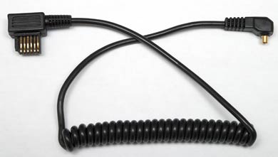 Coiled Cord &mdash; Male PC to Metz 6 Row Sync Cord