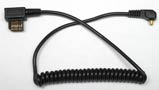Coiled Cord &mdash; Male PC to Metz 6 Row Sync Cord